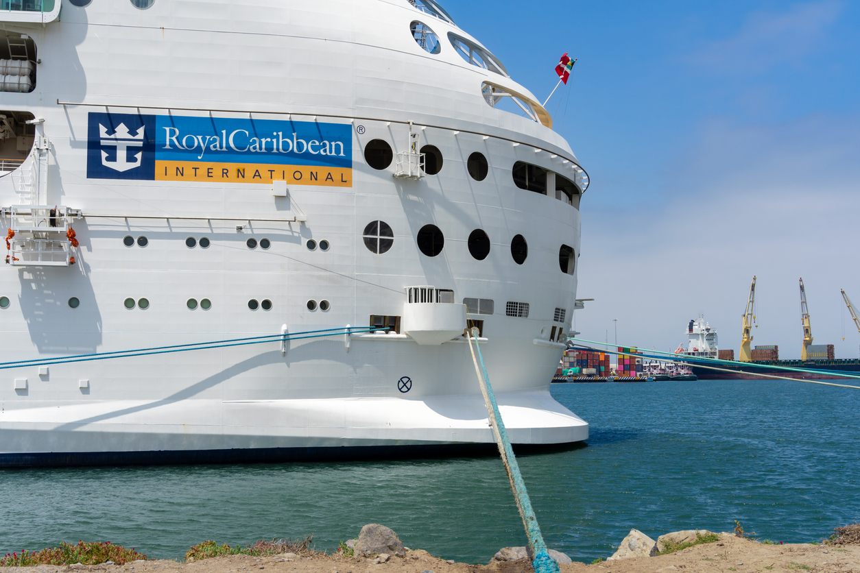 Consumer Cyclical (names I - Z) - Royal Caribbean Group logo on ship by- sanafel via iStock